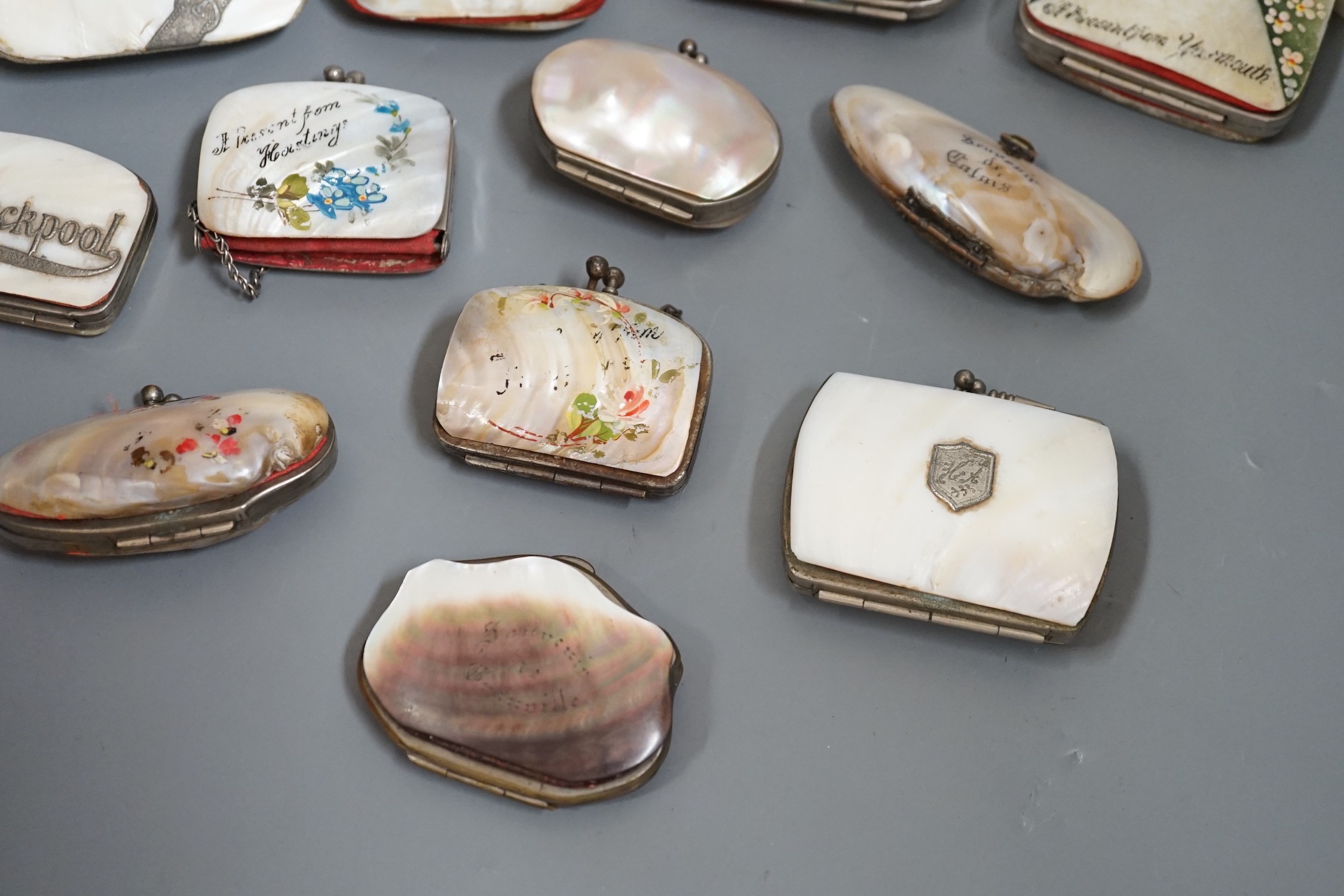 Nine 19th century souvenir mother of pearl purses, and three others